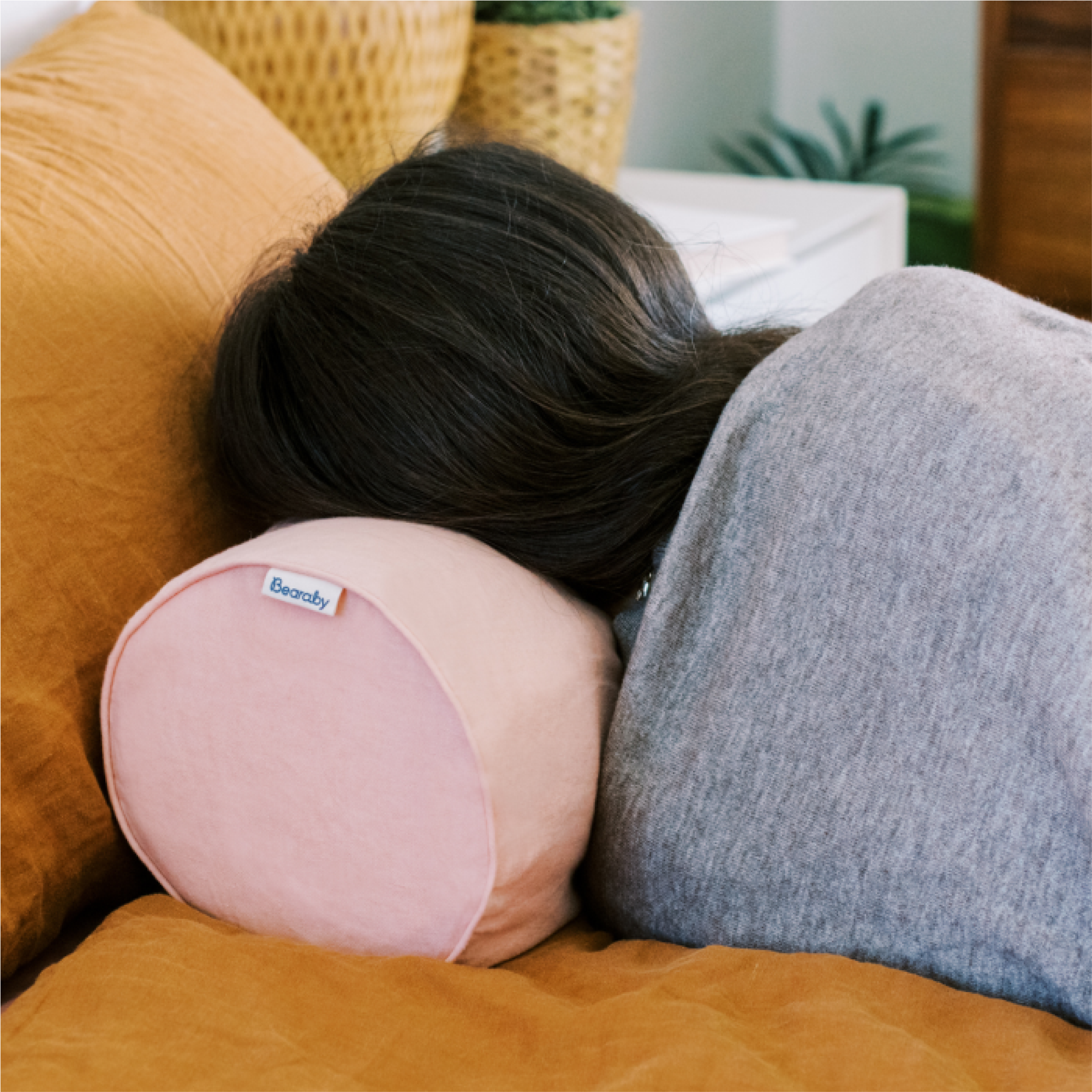 lady with bearaby bolster pillow