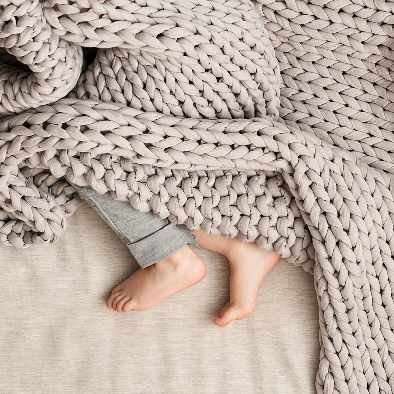 kid with bearaby nappling blanket